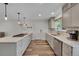 Bright, remodeled kitchen with modern cabinets, and stainless steel appliances at 11000 Eudora Cir, Thornton, CO 80233