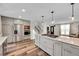 Bright, modern kitchen with quartz countertops, stainless appliances, with open-concept living spaces at 11000 Eudora Cir, Thornton, CO 80233