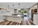 Modern kitchen with stainless steel appliances, quartz countertops, and an island with cooktop at 11000 Eudora Cir, Thornton, CO 80233