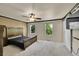 Main bedroom features dual windows, dark wood furniture, and modern sliding closet doors at 11000 Eudora Cir, Thornton, CO 80233