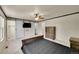 Main bedroom featuring a ceiling fan, and barn doors to access a closet and Primary bathroom at 11000 Eudora Cir, Thornton, CO 80233