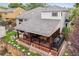 Large backyard with covered patio and dining area, perfect for outdoor entertaining and relaxation at 5282 Devon Ave, Castle Rock, CO 80104