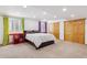 Spacious bedroom with large closet, carpet, and well lit with recessed lighting at 5282 Devon Ave, Castle Rock, CO 80104