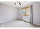 This bedroom has carpet and natural light from the window with light filtering curtains at 5282 Devon Ave, Castle Rock, CO 80104