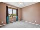 Bedroom with neutral carpet and colorful accents from curtains and view from window at 5282 Devon Ave, Castle Rock, CO 80104