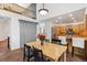 Open dining area with views to the kitchen and an upper floor loft at 5282 Devon Ave, Castle Rock, CO 80104