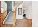 Welcoming foyer featuring tile floors, wooden staircase, and an open floorplan at 5282 Devon Ave, Castle Rock, CO 80104