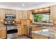 Beautiful kitchen featuring granite countertops, and stainless steel appliances at 5282 Devon Ave, Castle Rock, CO 80104