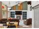 Inviting living area open to dining, featuring a fireplace and ample seating at 5282 Devon Ave, Castle Rock, CO 80104