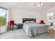 Comfortable bedroom with carpet, a ceiling fan, neutral walls, and a large window for ample natural light at 5282 Devon Ave, Castle Rock, CO 80104