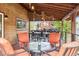 Covered patio with an outdoor dining and conversation area at 5282 Devon Ave, Castle Rock, CO 80104