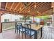 Outdoor patio with lights, outdoor dining table and chairs, as well as a conversation area at 5282 Devon Ave, Castle Rock, CO 80104