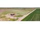 Aerial view of house situated on land with fields and neighboring properties visible at 41575 E 88Th Ave, Bennett, CO 80102