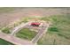 Aerial view showcasing the house in a verdant setting, offering expansive land at 41575 E 88Th Ave, Bennett, CO 80102