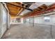 Spacious unfinished basement with visible ceiling and support beams at 41575 E 88Th Ave, Bennett, CO 80102