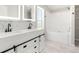 Modern bathroom featuring double vanity, illuminated mirrors and separate tub at 41575 E 88Th Ave, Bennett, CO 80102