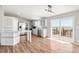 Bright, modern kitchen with stainless steel appliances, light gray cabinets, and wood flooring at 41575 E 88Th Ave, Bennett, CO 80102