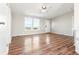 Inviting living room with laminate wood flooring, ceiling fan and lots of natural light at 41575 E 88Th Ave, Bennett, CO 80102