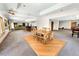 Open basement with a dining area, bar, and living space; offering ample room for entertaining at 2595 S Harlan Ct, Lakewood, CO 80227
