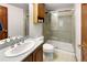 Clean and tidy bathroom featuring a stand-up shower, vanity, tile flooring, and plenty of light at 2595 S Harlan Ct, Lakewood, CO 80227