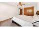 Bedroom featuring closet, window, a ceiling fan and carpeted floors at 2595 S Harlan Ct, Lakewood, CO 80227