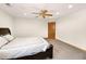 Neutral bedroom featuring plush carpet, ceiling fan, recessed lighting and a solid wood door at 2595 S Harlan Ct, Lakewood, CO 80227