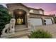 Inviting home entrance with stone accents, lion statues, and a well-lit doorway at 2595 S Harlan Ct, Lakewood, CO 80227