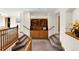 Inviting hallway with built-in shelving and stairway to second floor at 2595 S Harlan Ct, Lakewood, CO 80227