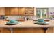Close-up of a kitchen counter with cabinets, featuring neutral countertops and backsplash at 2595 S Harlan Ct, Lakewood, CO 80227