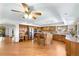 Open kitchen with ample cabinet space, a large island, and hardwood floors at 2595 S Harlan Ct, Lakewood, CO 80227