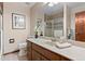 Clean bathroom with a large vanity, shower, and mirror at 9724 E Villasur Ct, Parker, CO 80134