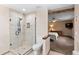 Bathroom with walk-in shower, toilet and views to bedroom at 9724 E Villasur Ct, Parker, CO 80134