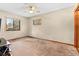 Spacious bedroom with large window and ceiling fan at 9724 E Villasur Ct, Parker, CO 80134