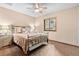 Bright bedroom with ceiling fan and neutral decor at 9724 E Villasur Ct, Parker, CO 80134