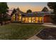 Back exterior view of the home highlighting the large windows and deck at 9724 E Villasur Ct, Parker, CO 80134