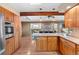 Bright kitchen with wood cabinets and granite countertops at 9724 E Villasur Ct, Parker, CO 80134