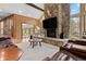 Large living room with a floor-to-ceiling stone fireplace at 9724 E Villasur Ct, Parker, CO 80134