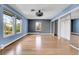 Spacious bedroom with hardwood floors, ample natural light, and mirrored closet doors at 12341 E Cedar Cir, Aurora, CO 80012