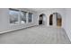 Large living room featuring a light, neutral paint palette, modern carpet and entry to front door at 12341 E Cedar Cir, Aurora, CO 80012