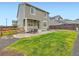 Spacious backyard featuring a patio, fenced in yard, and manicured green grass at 14687 Eudora St, Thornton, CO 80602