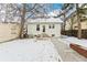 Spacious backyard with concrete patio and mature trees at 2167 S Emerson St, Denver, CO 80210