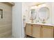 Modern bathroom with double vanity and stylish gold fixtures at 2167 S Emerson St, Denver, CO 80210