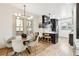 Modern farmhouse dining room with a round wooden table and white chairs at 2167 S Emerson St, Denver, CO 80210