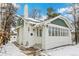 Updated craftsman bungalow with a white brick exterior and green accents at 2167 S Emerson St, Denver, CO 80210