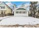 Charming bungalow with a newly renovated exterior and snow-covered front yard at 2167 S Emerson St, Denver, CO 80210