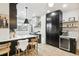 Updated kitchen featuring dark cabinetry and quartz countertops at 2167 S Emerson St, Denver, CO 80210