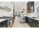 Eat-in kitchen boasting stainless steel appliances and a center island at 2167 S Emerson St, Denver, CO 80210