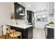 Stylish kitchen with white quartz countertops and dark cabinetry at 2167 S Emerson St, Denver, CO 80210