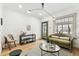 Living room with a green couch, fireplace, and hardwood floors at 2167 S Emerson St, Denver, CO 80210