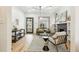 Open concept living room with hardwood floors and a view into the kitchen at 2167 S Emerson St, Denver, CO 80210